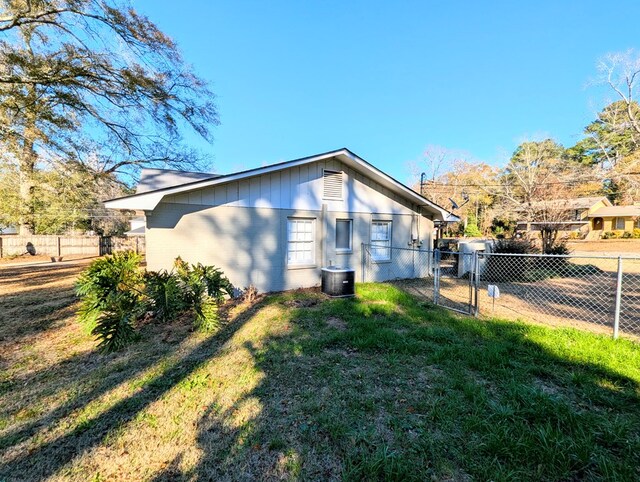 view of property exterior with a lawn