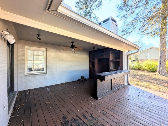 wooden deck featuring ceiling fan