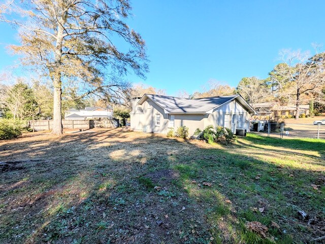 view of property exterior featuring a yard and cooling unit