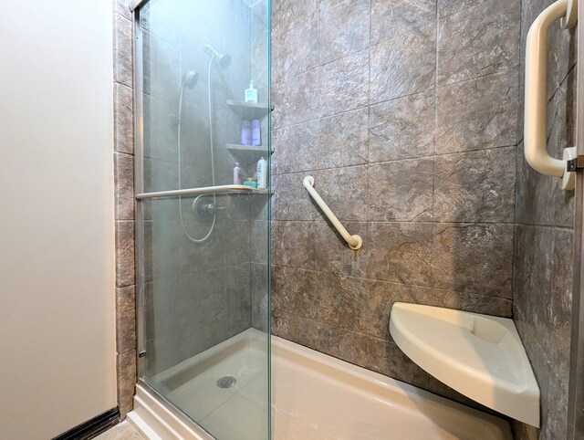 bathroom with a shower with shower door