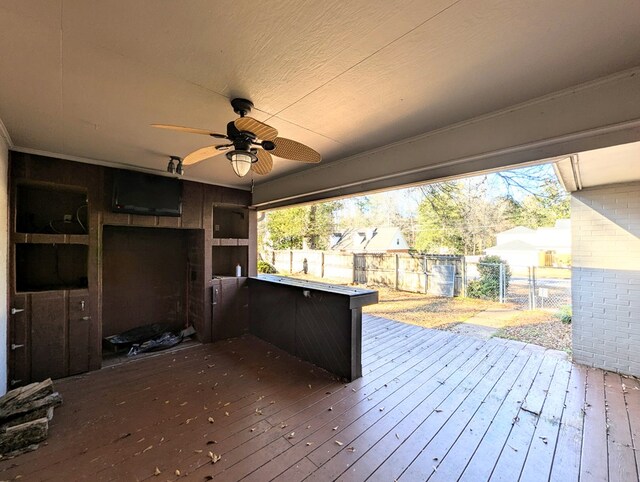 wooden terrace featuring ceiling fan