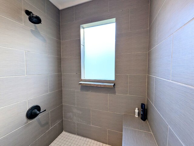 bathroom with a tile shower