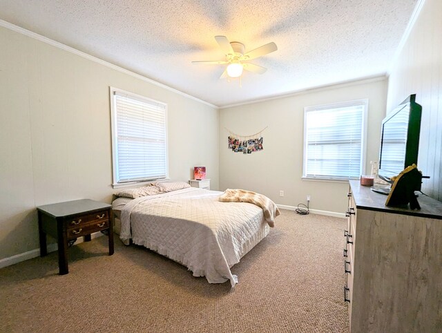 carpeted bedroom with ceiling fan, crown molding, and a textured ceiling