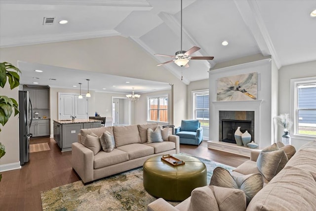 459 Paxton, Dothan, AL 36301 - living area featuring a ceiling fan, a fireplace, dark wood-style floors, beamed ceiling, and a chandelier