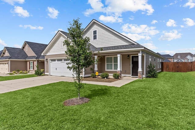 view of front of house featuring fence, a front yard, an attached garage, and concrete driveway