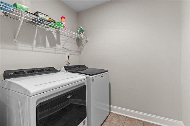 459 Paxton, Dothan, AL 36301 - laundry room with baseboards, washer and clothes dryer, and light tile patterned floors