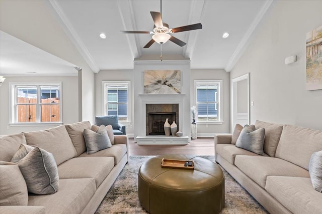 459 Paxton, Dothan, AL 36301 - living room with ceiling fan, wood finished floors, a tiled fireplace, ornamental molding, and baseboards