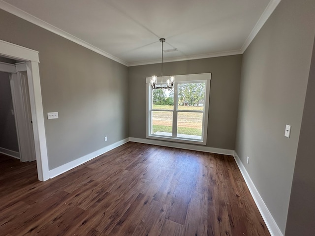 unfurnished dining area featuring dark hardwood / wood-style floors, crown molding, and a chandelier