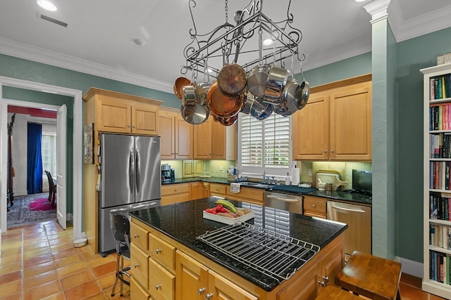6 Williamsburg Pl, Dothan, AL 36305 - kitchen with appliances with stainless steel finishes, tasteful backsplash, a sink, ornamental molding, and a kitchen island