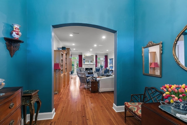 6 Williamsburg Pl, Dothan, AL 36305 - hallway featuring wood finished floors, recessed lighting, arched walkways, ornamental molding, and baseboards