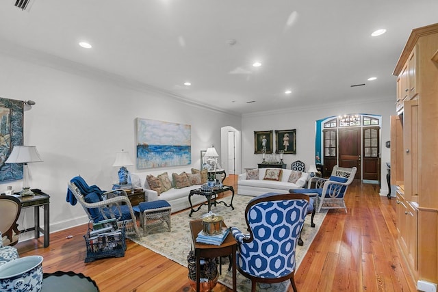 6 Williamsburg Pl, Dothan, AL 36305 - living room with light wood finished floors, arched walkways, recessed lighting, baseboards, and a chandelier
