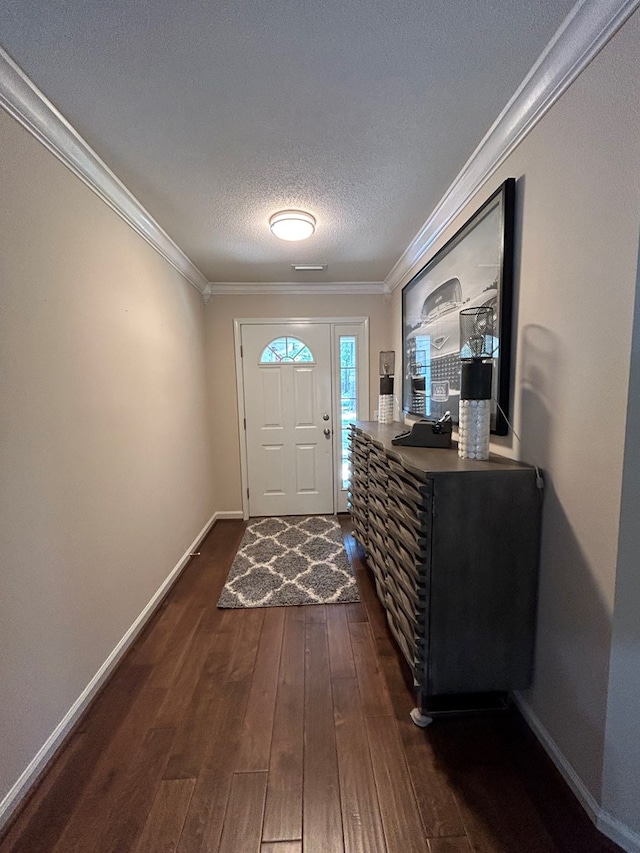 123 Waterford Way, Ashford, AL 36321 - foyer featuring ornamental molding, dark wood-type flooring, a textured ceiling, and baseboards