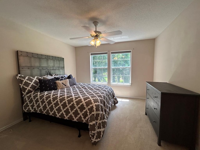 123 Waterford Way, Ashford, AL 36321 - bedroom featuring light colored carpet, ceiling fan, baseboards, and a textured ceiling