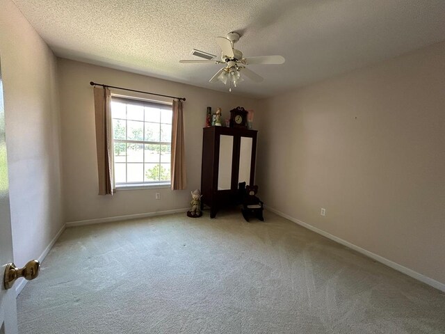 123 Waterford Way, Ashford, AL 36321 - unfurnished room featuring carpet flooring, a ceiling fan, baseboards, and a textured ceiling