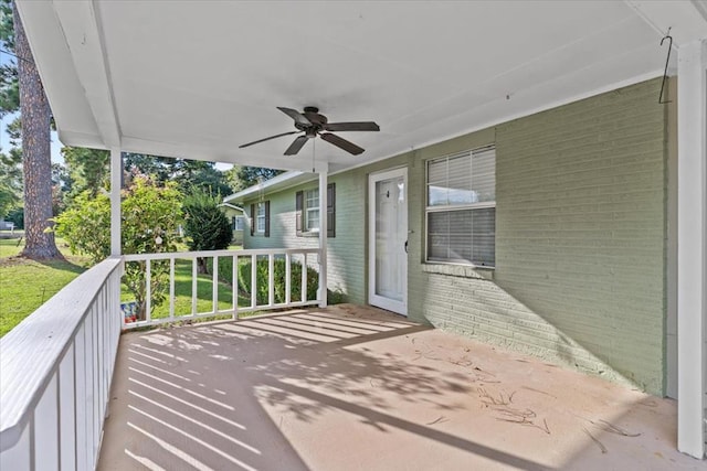 view of patio featuring ceiling fan and a porch