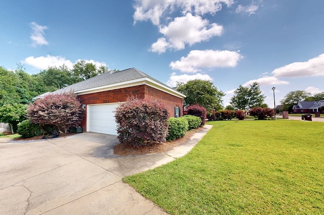 218 Azalea Ln, Headland, AL 36345 - view of property exterior featuring brick siding, a lawn, driveway, and an attached garage