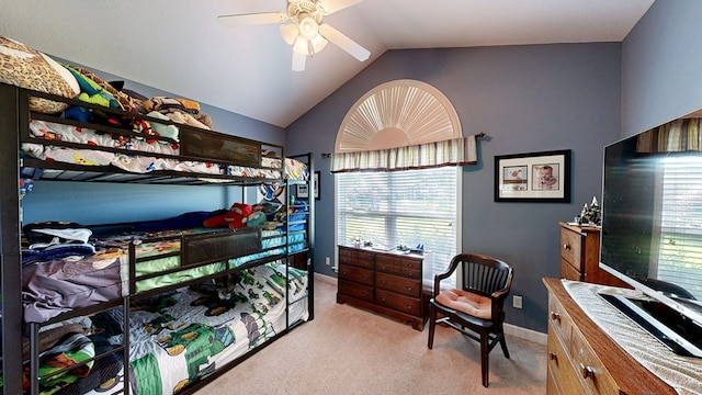 218 Azalea Ln, Headland, AL 36345 - bedroom featuring multiple windows, light colored carpet, lofted ceiling, baseboards, and a ceiling fan