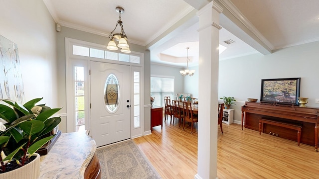 218 Azalea Ln, Headland, AL 36345 - foyer featuring a chandelier, crown molding, light wood finished floors, decorative columns, and baseboards