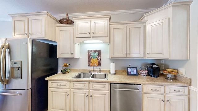 218 Azalea Ln, Headland, AL 36345 - kitchen with stainless steel appliances, a sink, light countertops, and cream cabinetry