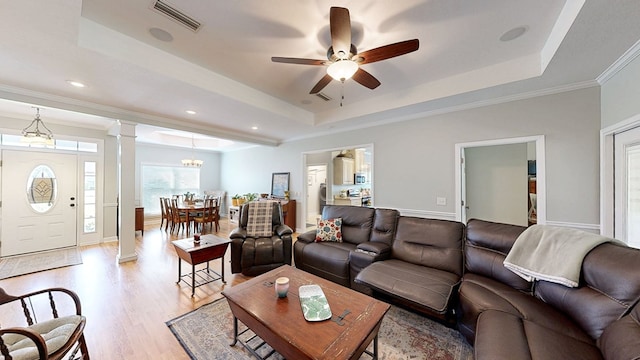 218 Azalea Ln, Headland, AL 36345 - living room featuring a tray ceiling, light wood-type flooring, ceiling fan, ornamental molding, and recessed lighting