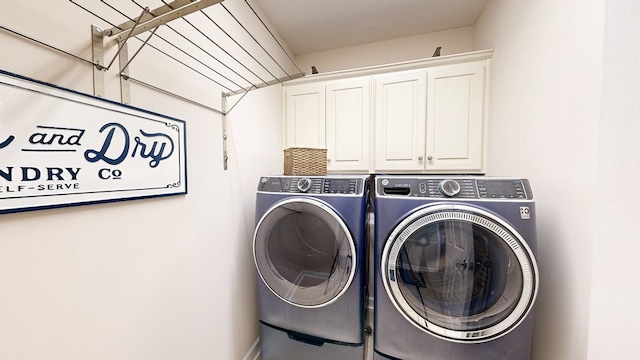 218 Azalea Ln, Headland, AL 36345 - laundry area with cabinet space and washing machine and clothes dryer
