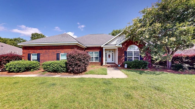218 Azalea Ln, Headland, AL 36345 - view of front of house with a front lawn, brick siding, and roof with shingles