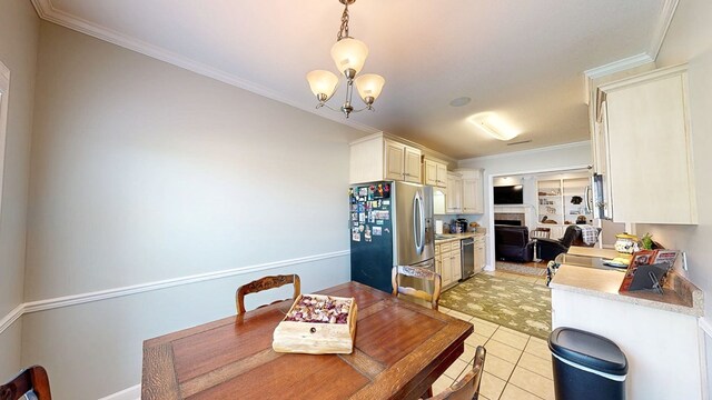 218 Azalea Ln, Headland, AL 36345 - dining room featuring ornamental molding, light tile patterned flooring, and a chandelier