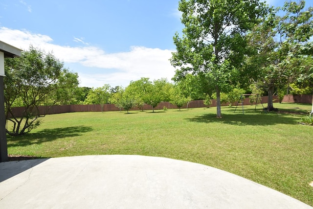 view of yard featuring a patio area and a fenced backyard