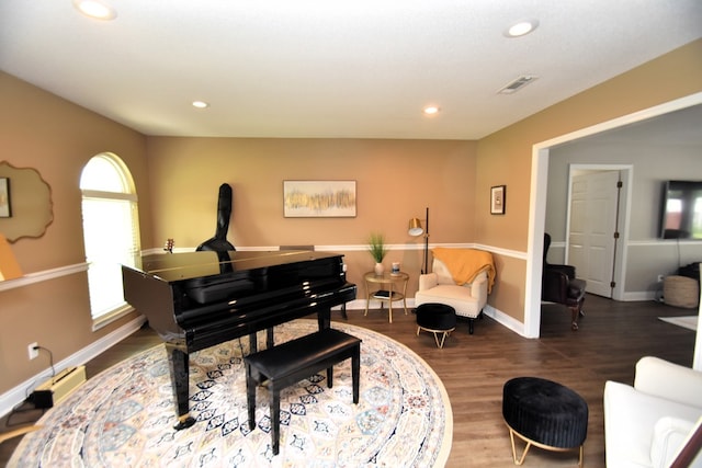 sitting room with baseboards, visible vents, recessed lighting, and wood finished floors