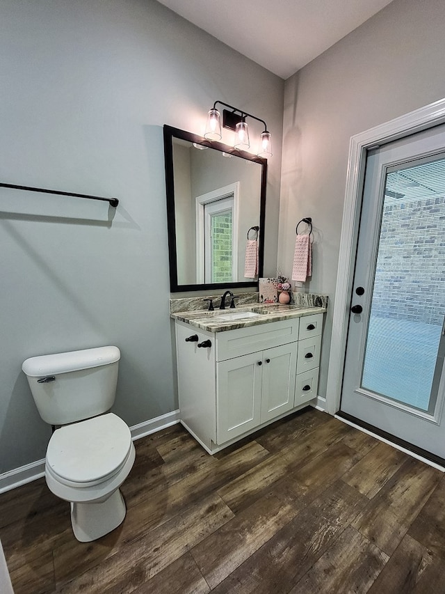 212 Archer Trl, Enterprise, AL 36330 - bathroom with baseboards, toilet, and wood finished floors