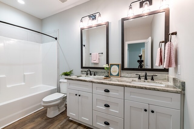 212 Archer Trl, Enterprise, AL 36330 - full bathroom with wood finished floors, a sink, double vanity, and toilet