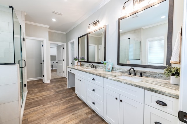 212 Archer Trl, Enterprise, AL 36330 - full bathroom featuring ornamental molding, wood finished floors, a sink, and a stall shower