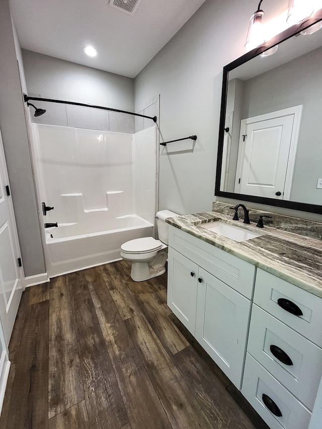 212 Archer Trl, Enterprise, AL 36330 - bathroom featuring  shower combination, toilet, visible vents, wood finished floors, and vanity
