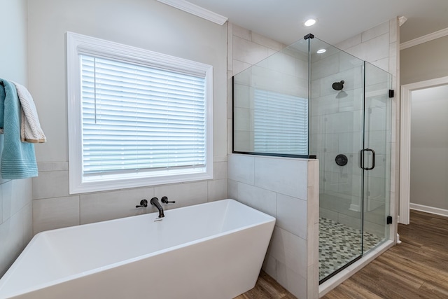 212 Archer Trl, Enterprise, AL 36330 - bathroom featuring a soaking tub, recessed lighting, wood finished floors, a shower stall, and ornamental molding