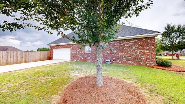 201 W Azalea Ln, Headland, AL 36345 - view of side of property featuring concrete driveway, a shingled roof, brick siding, and an attached garage