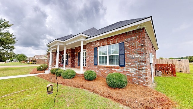 201 W Azalea Ln, Headland, AL 36345 - view of front of home with a porch and brick siding