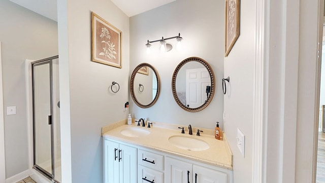201 W Azalea Ln, Headland, AL 36345 - bathroom featuring a stall shower and double vanity