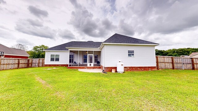 201 W Azalea Ln, Headland, AL 36345 - rear view of property with a fenced backyard, a patio area, and roof with shingles