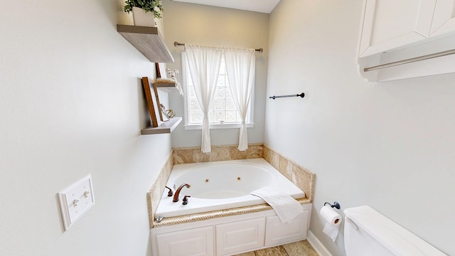 201 W Azalea Ln, Headland, AL 36345 - bathroom featuring a jetted tub and toilet
