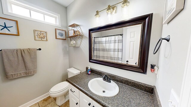 201 W Azalea Ln, Headland, AL 36345 - full bath featuring vanity, tile patterned floors, and a shower with shower curtain