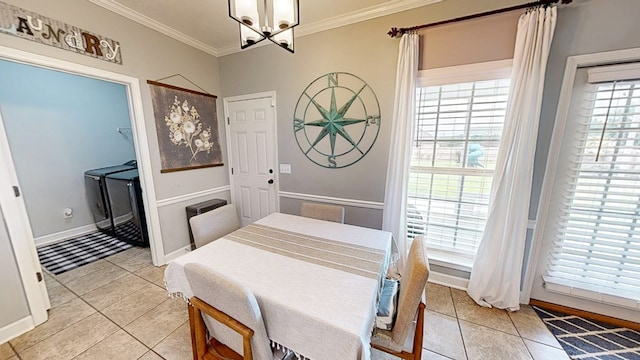 201 W Azalea Ln, Headland, AL 36345 - dining room with light tile patterned floors, a chandelier, and crown molding