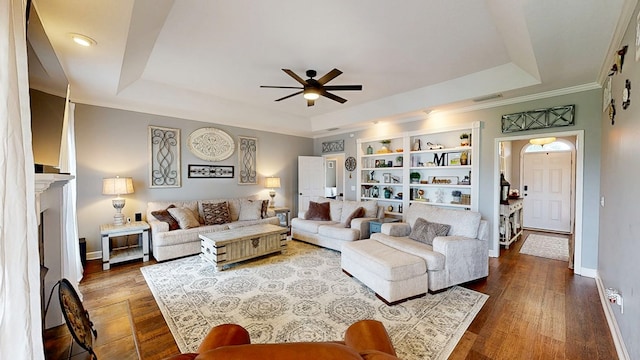 201 W Azalea Ln, Headland, AL 36345 - living area with a raised ceiling, ceiling fan, wood finished floors, ornamental molding, and built in shelves