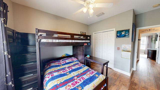 201 W Azalea Ln, Headland, AL 36345 - bedroom featuring wood finished floors, a closet, and a ceiling fan