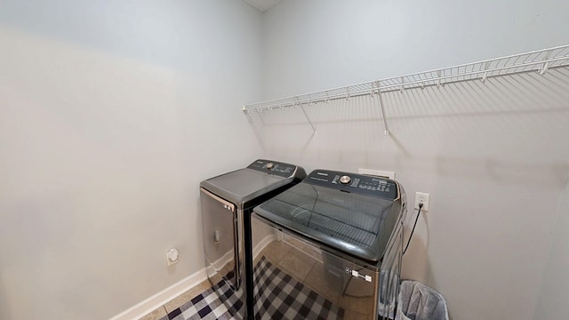 201 W Azalea Ln, Headland, AL 36345 - washroom featuring separate washer and dryer and baseboards