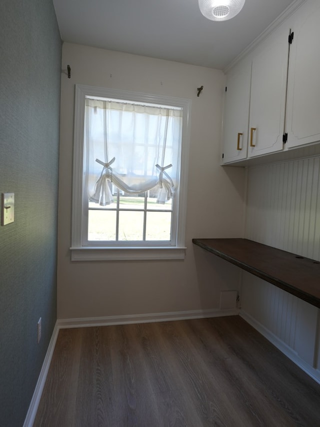 unfurnished dining area with dark hardwood / wood-style flooring