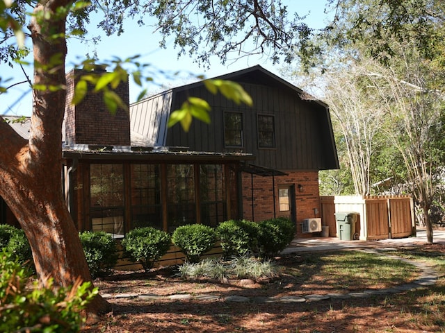 exterior space featuring a sunroom