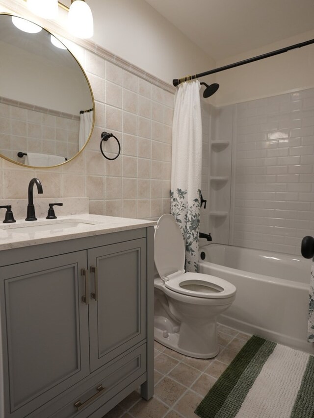 full bathroom featuring tile patterned floors, decorative backsplash, shower / bath combo, and tile walls