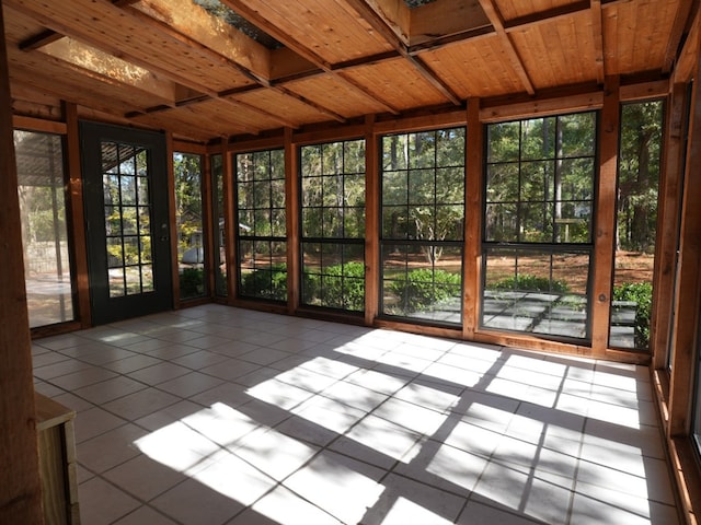 unfurnished sunroom with wood ceiling and a wealth of natural light