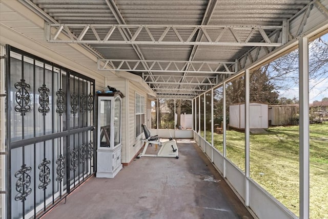 view of patio with a storage shed and an outdoor structure