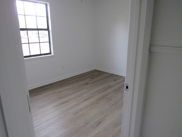 empty room with light hardwood / wood-style floors